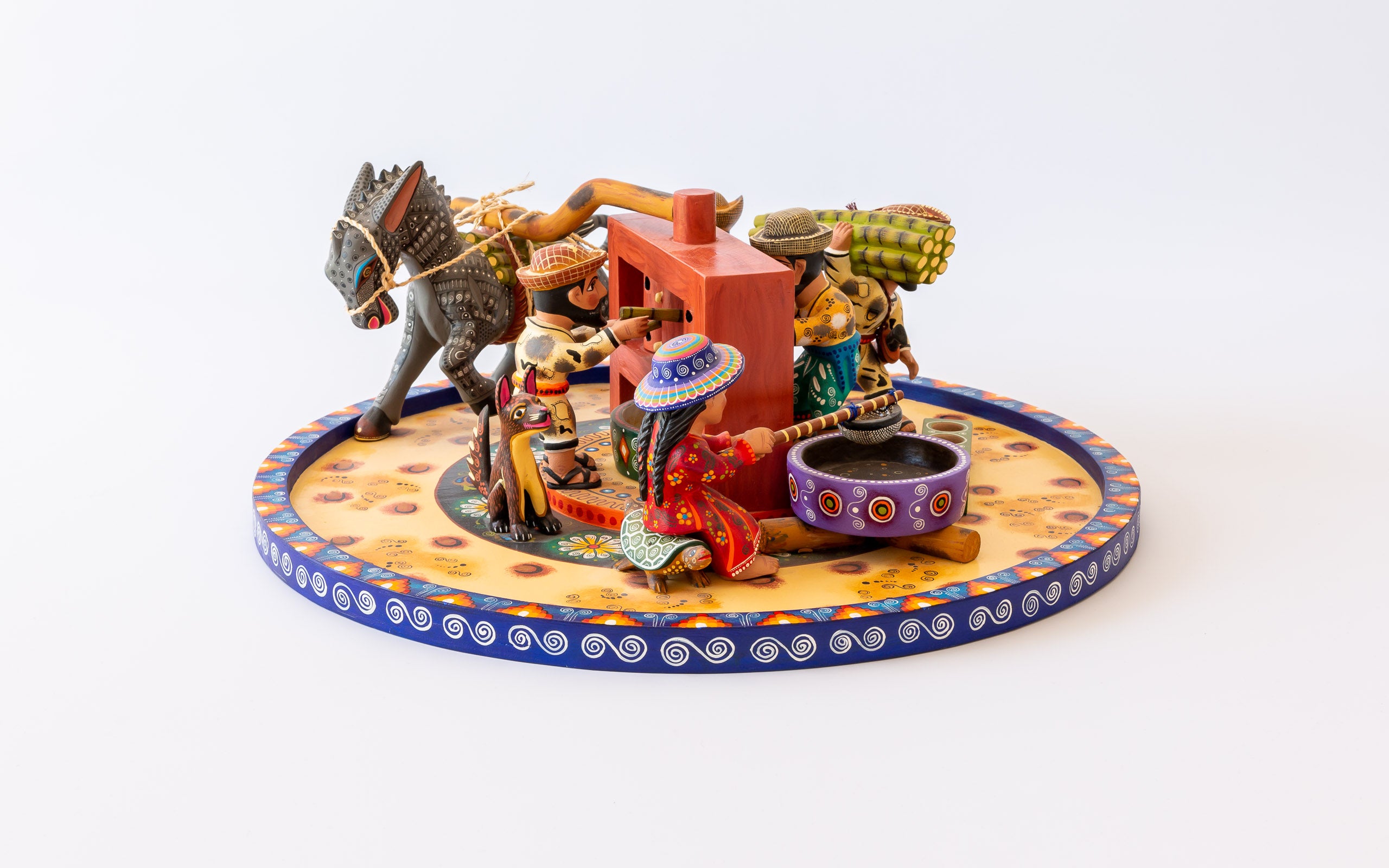 Zuckerrohrmühle: Bunte Szene rund um die Mühle, Kunsthandwerk aus Oaxaca, weitere Ansicht der Arbeit von Agustin Cruz Tinoco
